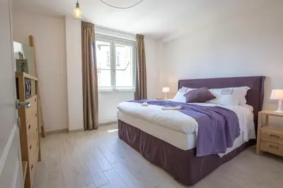 Letto o letti in una camera di Coco Places Firenze, Centro Storico