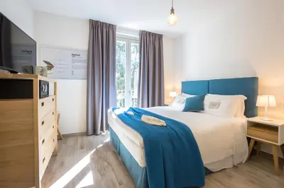Letto o letti in una camera di Coco Places Firenze, Centro Storico