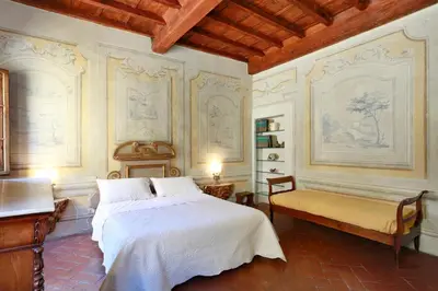 Letto o letti in una camera di Residenza di charme pressi piazza Pitti