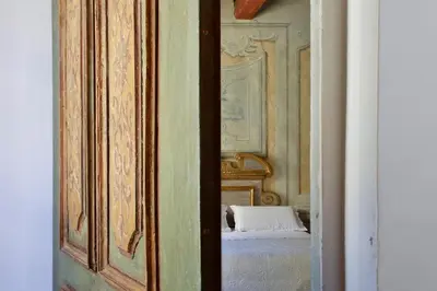 Letto o letti in una camera di Residenza di charme pressi piazza Pitti