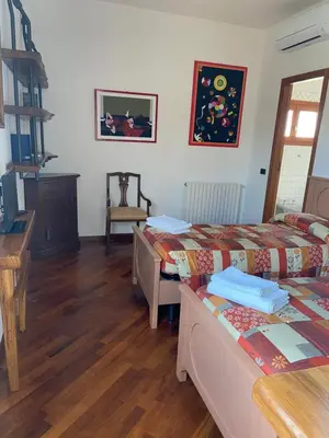 Letto o letti in una camera di Villa Gallorosso
