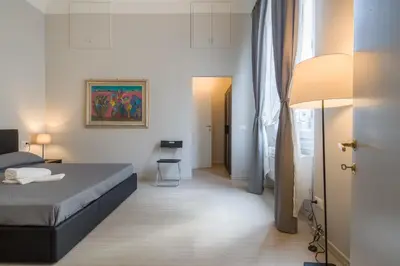 Letto o letti in una camera di Beccaria Suite