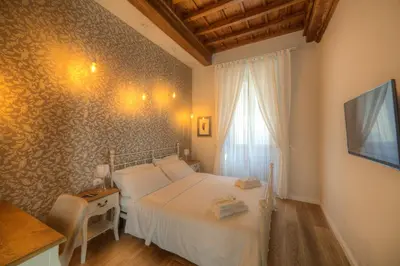 Letto o letti in una camera di Assaporarte