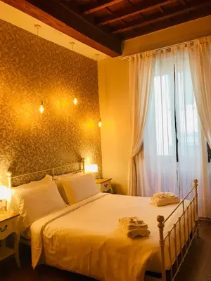 Letto o letti in una camera di Assaporarte