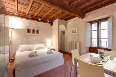 Letto o letti in una camera di Cupolone Apartment by Mamo Florence