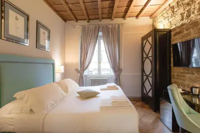 Letto o letti in una camera di Relais Tosinghi
