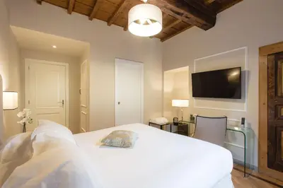 Letto o letti in una camera di Relais Tosinghi
