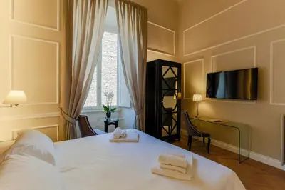 Letto o letti in una camera di Relais Tosinghi