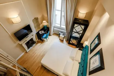 Letto o letti in una camera di Relais Tosinghi