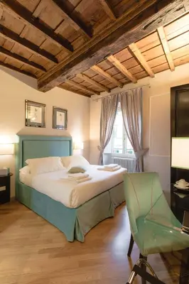 Letto o letti in una camera di Relais Tosinghi