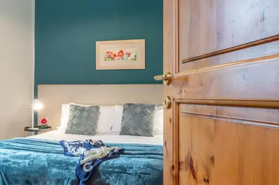 Letto o letti in una camera di San Lorenzo Five Senses