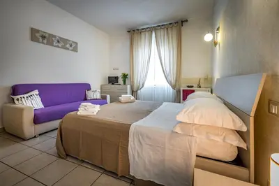 Letto o letti in una camera di Affittacamere San Jacopino