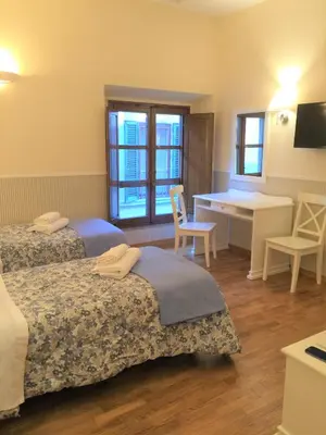 Letto o letti in una camera di Relais Duomo Adelaide