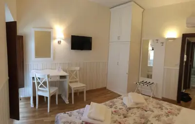 Letto o letti in una camera di Relais Duomo Adelaide