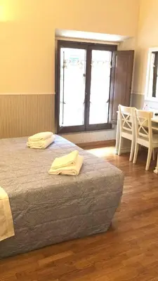 Letto o letti in una camera di Relais Duomo Adelaide