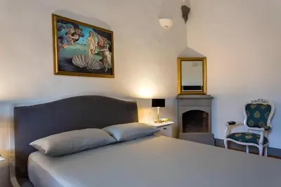 Letto o letti in una camera di Residenza d'Epoca Galleria dell'Accademia