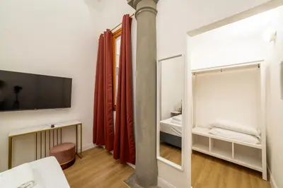 Letto o letti in una camera di Residenza d'Epoca Galleria dell'Accademia