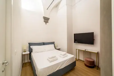 Letto o letti in una camera di Residenza d'Epoca Galleria dell'Accademia