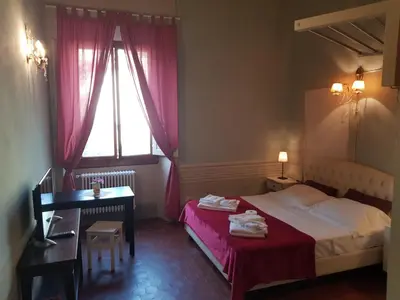 Letto o letti in una camera di B&B i Rinascimenti