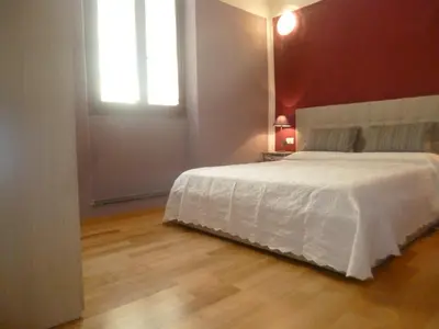 Letto o letti in una camera di Sunflower Santa Maria Novella