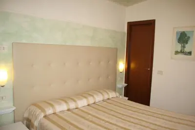 Letto o letti in una camera di Albergo Il Giglio