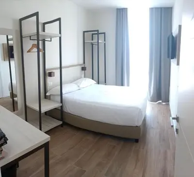 Letto o letti in una camera di Hotel Cantoria