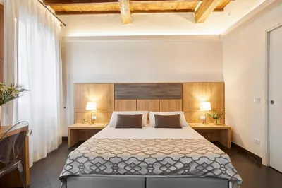 Letto o letti in una camera di Sette Angeli Rooms