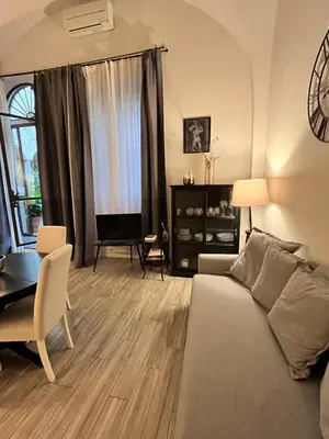Area soggiorno di Cynthia's Garden - Apartment with private garden in Santa Croce