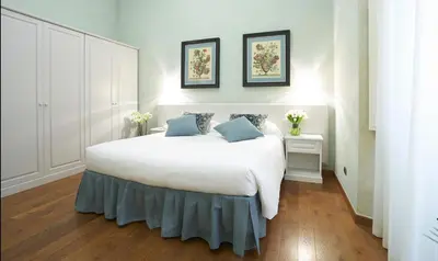 Letto o letti in una camera di B&B La Signoria Di Firenze