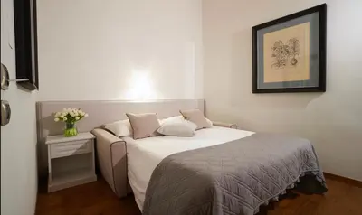 Letto o letti in una camera di B&B La Signoria Di Firenze
