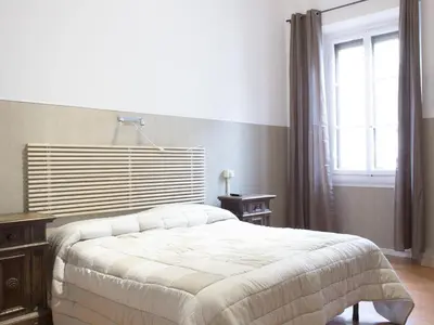 Letto o letti in una camera di Loggia Fiorentina