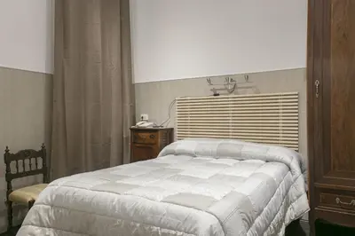 Letto o letti in una camera di Loggia Fiorentina