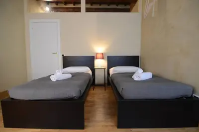 Letto o letti in una camera di Keys of Italy - Palazzuolo 112 - Keys Of Italy