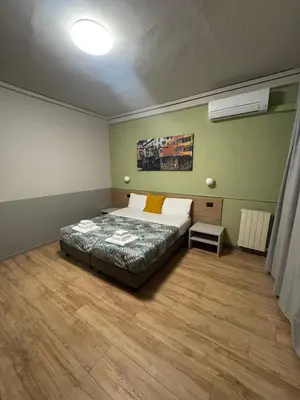 Letto o letti in una camera di Hotel Camilla Guelfa