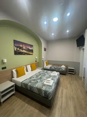 Letto o letti in una camera di Hotel Camilla Guelfa
