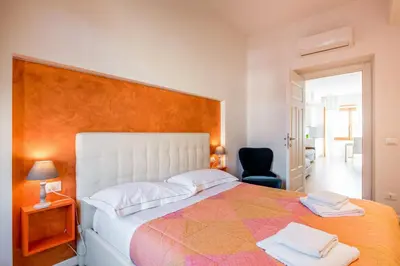 Letto o letti in una camera di GuestHost - Santa Maria Novella Cozy Flat