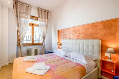 Letto o letti in una camera di GuestHost - Santa Maria Novella Cozy Flat