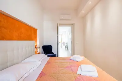 Letto o letti in una camera di GuestHost - Santa Maria Novella Cozy Flat