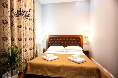 Letto o letti in una camera di Hotel Aida