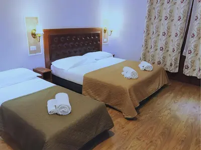 Letto o letti in una camera di Hotel Aida