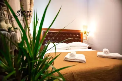 Letto o letti in una camera di Hotel Aida