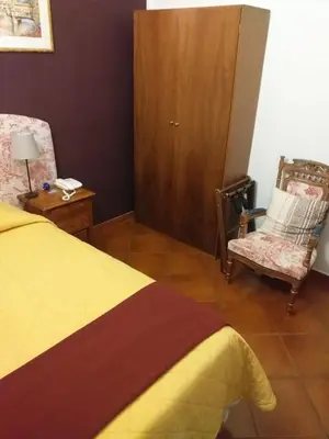 Letto o letti in una camera di Hotel Bologna