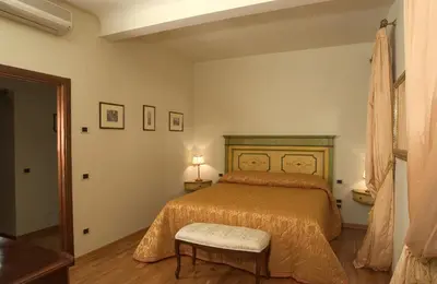 Letto o letti in una camera di Michelangiolo Penthouse