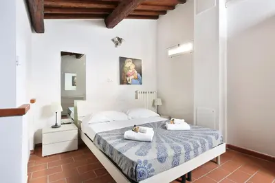 Letto o letti in una camera di Tornabuoni apartment in central Florence