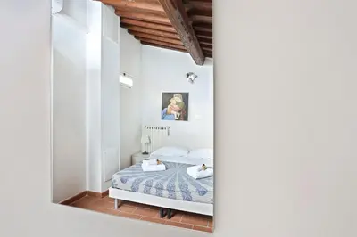 Letto o letti in una camera di Tornabuoni apartment in central Florence