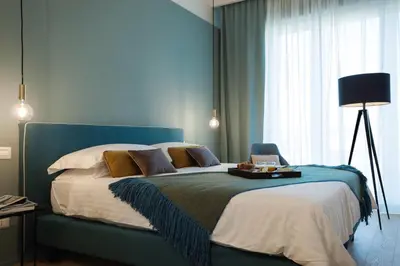 Letto o letti in una camera di B&B Lorena Suites