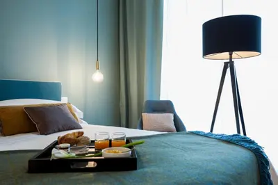 Letto o letti in una camera di B&B Lorena Suites
