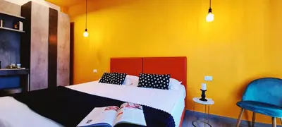 Letto o letti in una camera di B&B Lorena Suites