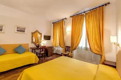 Letto o letti in una camera di Hotel Rex