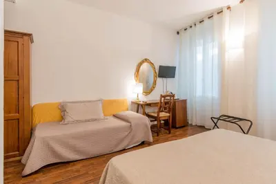 Letto o letti in una camera di Hotel Rex
